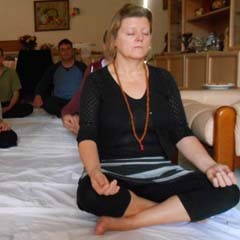 In Melbourne a Kriya Yoga student practices meditation under guidance from Swamijee